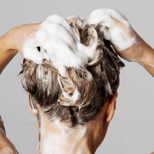 woman-with-shampoo-in-hair